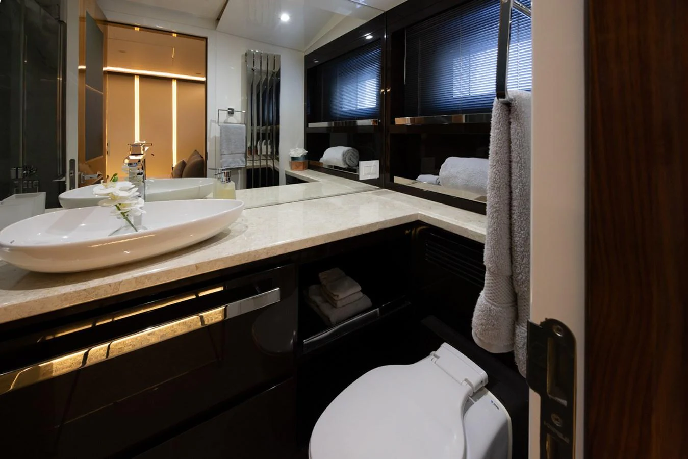 a bathroom with a sink and a toilet aboard KANDO Yacht for Sale