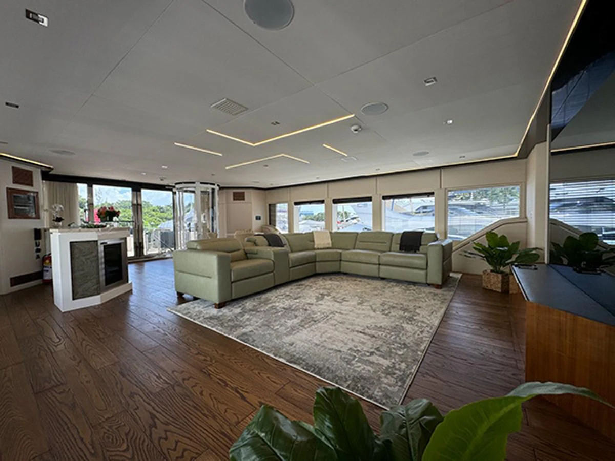 a living room with a large window aboard KANDO Yacht for Sale