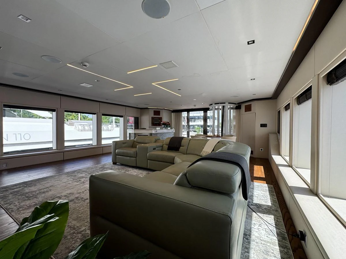 a living room with a couch and a tv aboard KANDO Yacht for Sale