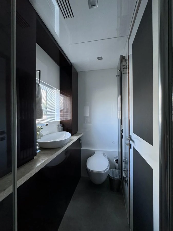 a bathroom with a sink and a toilet aboard KANDO Yacht for Sale