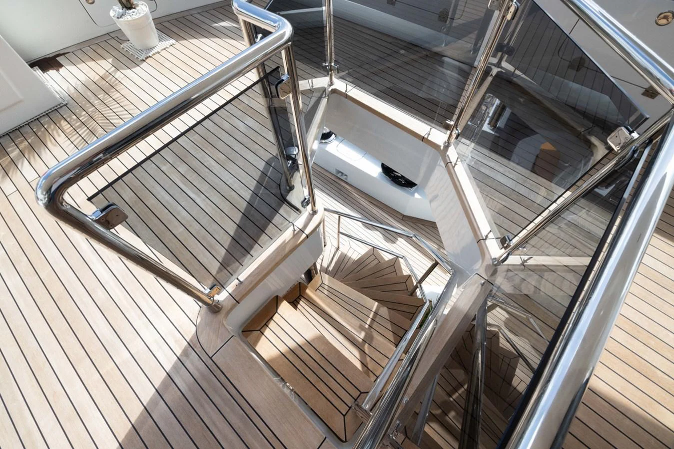 a metal staircase with metal railings aboard KANDO Yacht for Sale