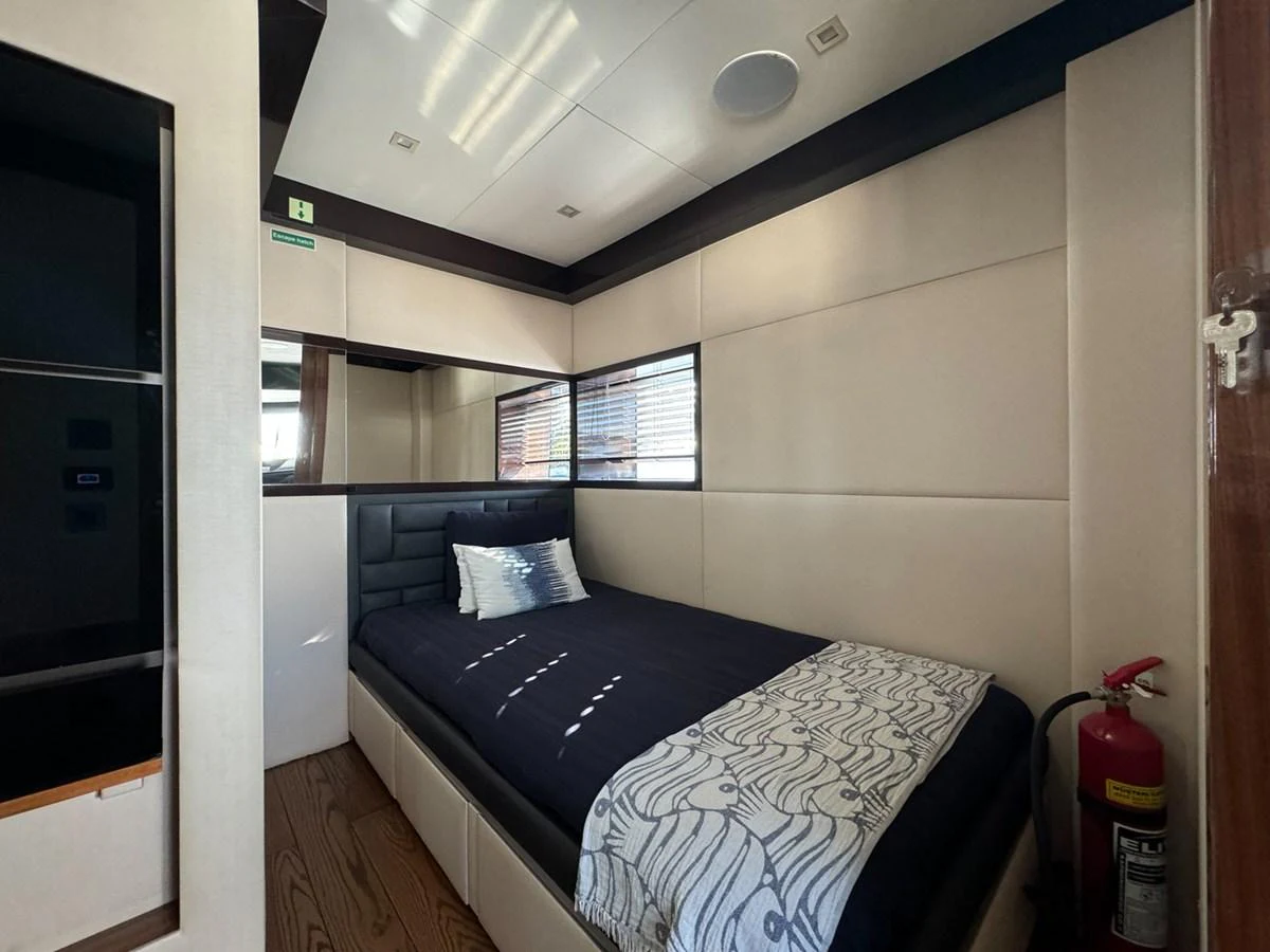 a bed in a room aboard KANDO Yacht for Sale