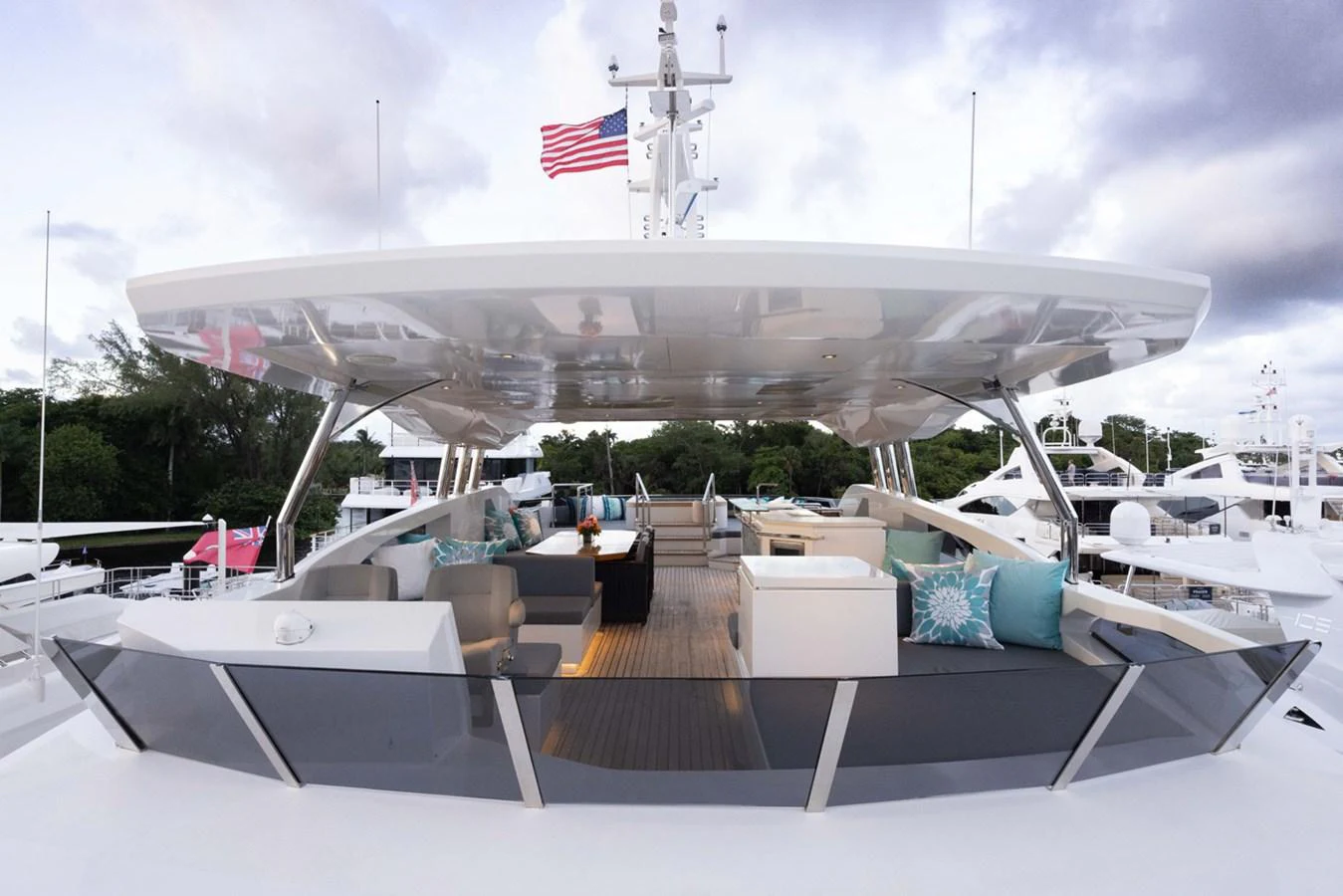 a large military ship docked aboard KANDO Yacht for Sale