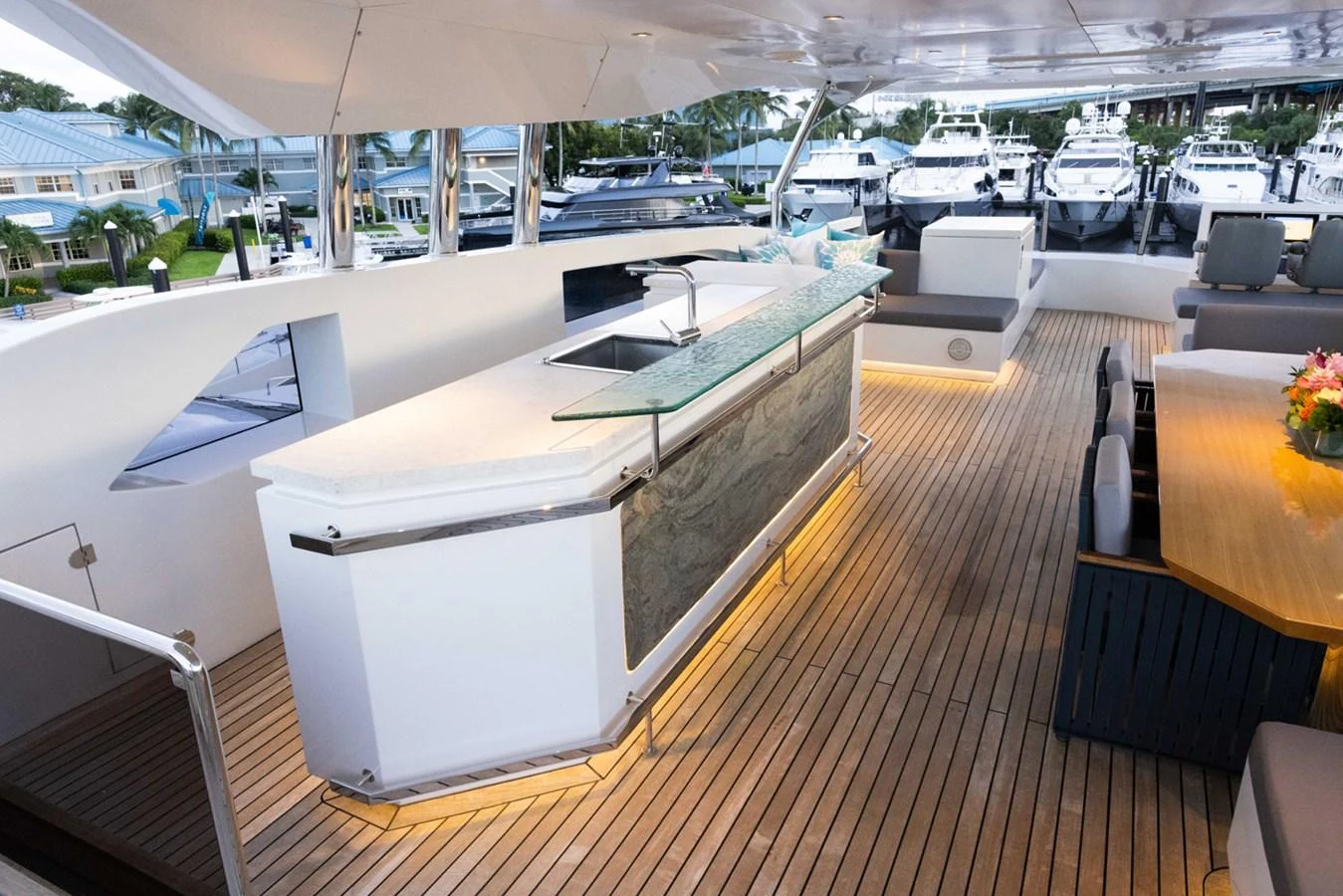a room with a table and chairs aboard KANDO Yacht for Sale