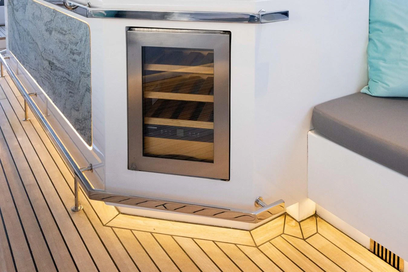 a white rectangular object with a black frame on a wooden surface aboard KANDO Yacht for Sale