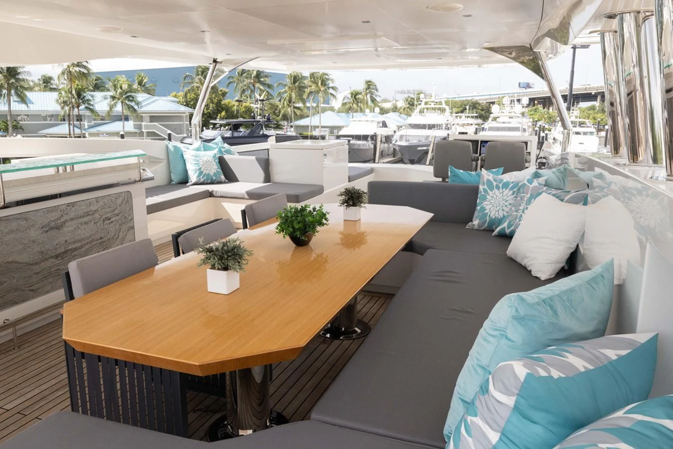 a patio with a table and chairs aboard KANDO Yacht for Sale
