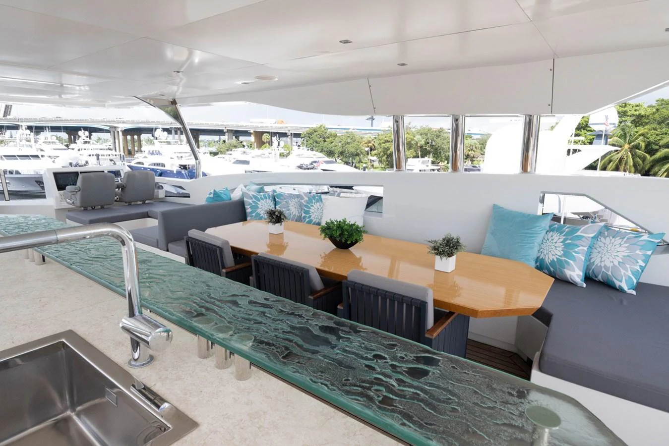 a large room with a table and chairs aboard KANDO Yacht for Sale