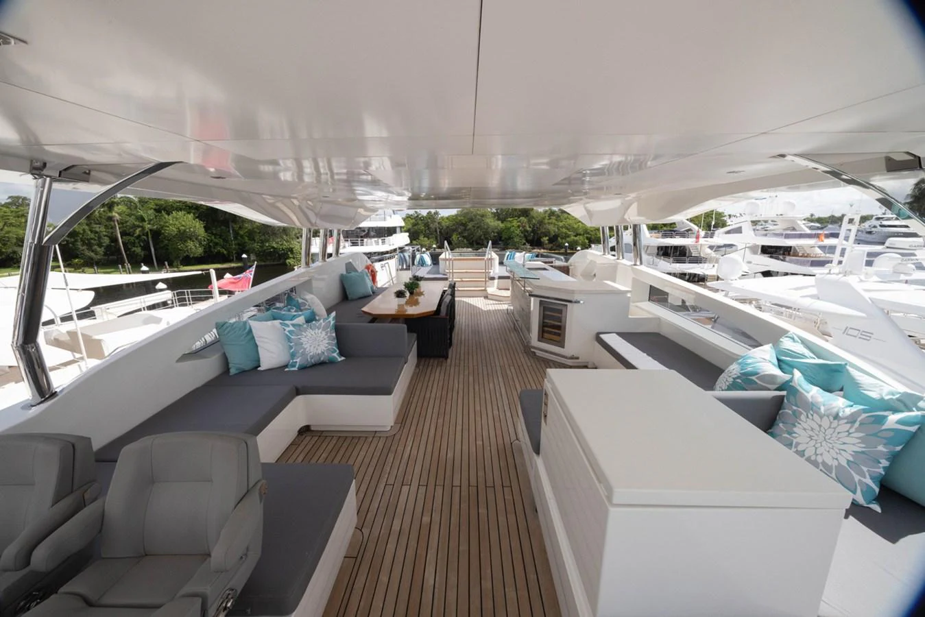 a boat deck with a deck and chairs aboard KANDO Yacht for Sale