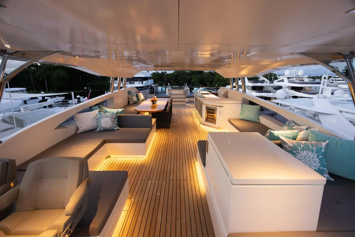 a room with a deck and a pool aboard KANDO Yacht for Sale