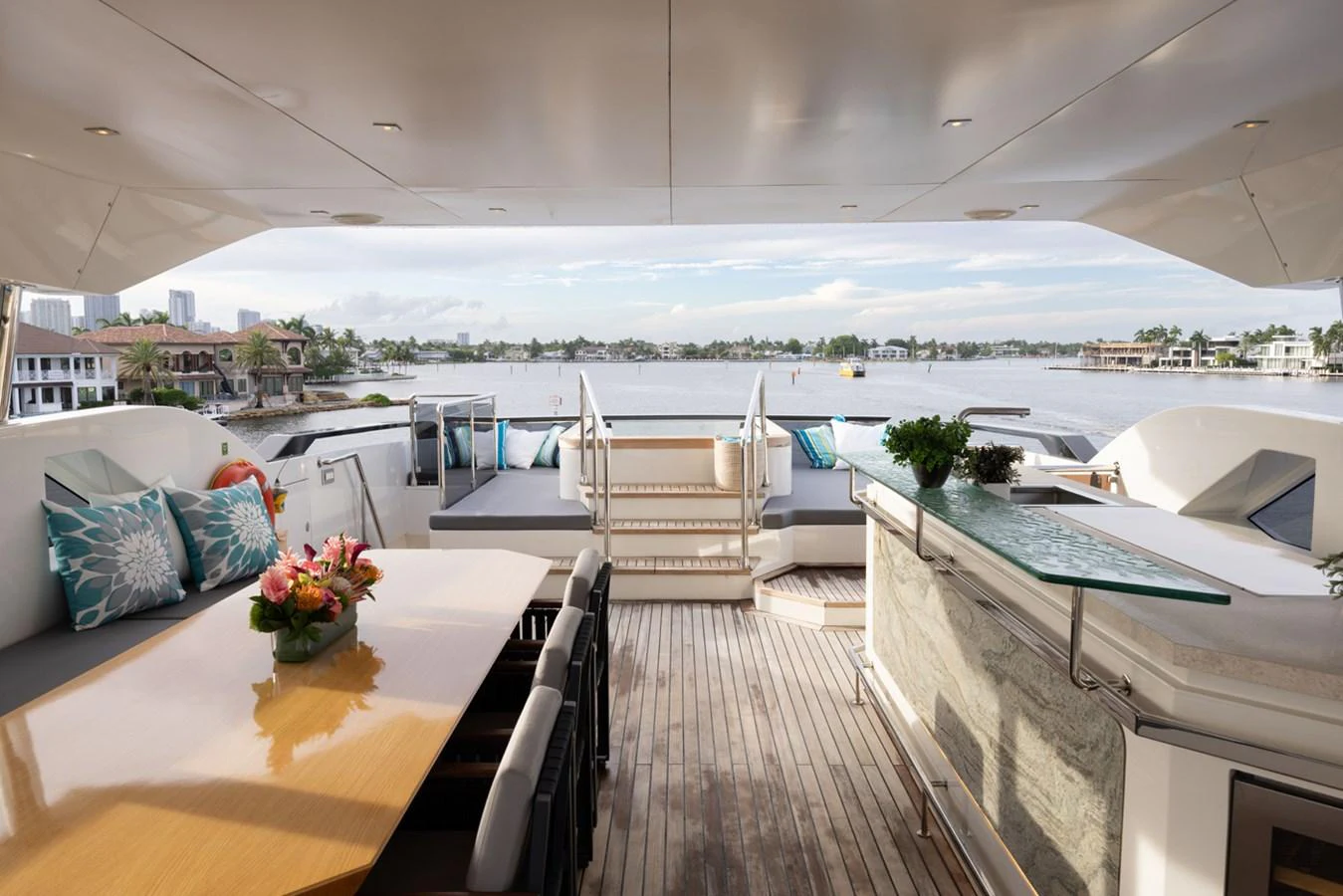 a balcony with a view of the ocean and the ocean aboard KANDO Yacht for Sale