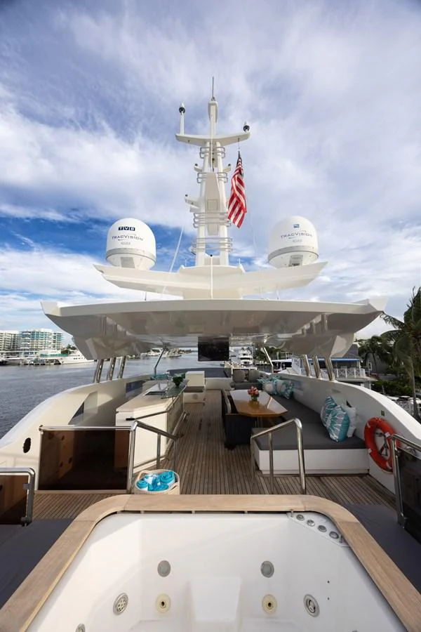 a ship docked at a pier aboard KANDO Yacht for Sale