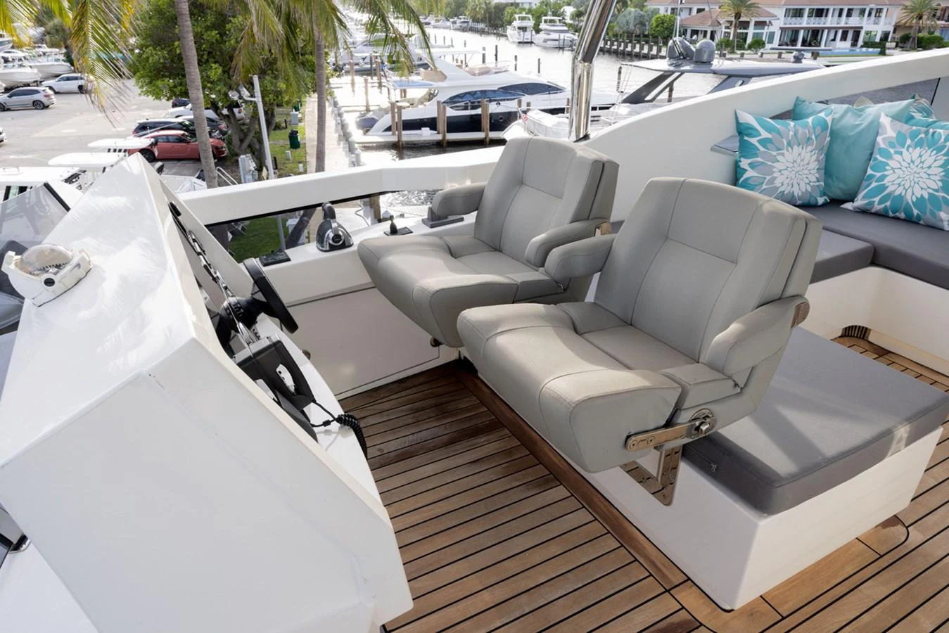 a white couch on a deck aboard KANDO Yacht for Sale