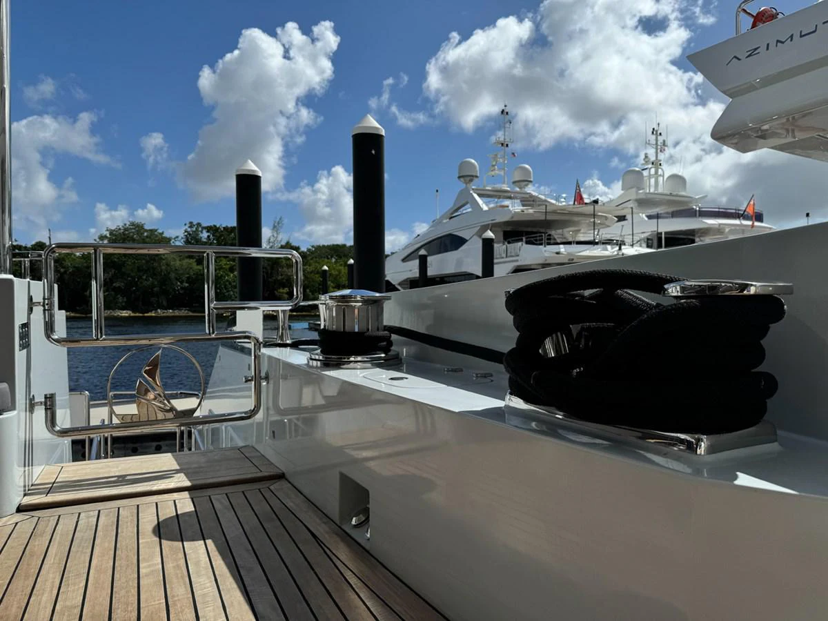 a large black ship docked aboard KANDO Yacht for Sale