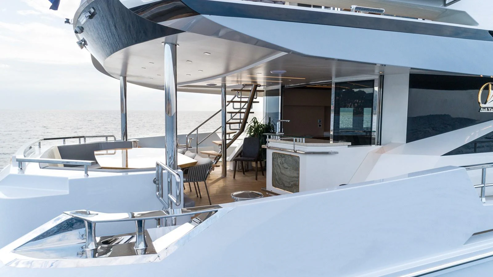 a room with a table and chairs aboard KANDO Yacht for Sale