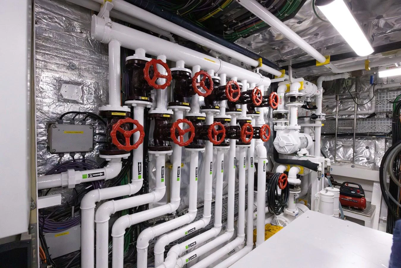 a machine with red and white lights aboard KANDO Yacht for Sale