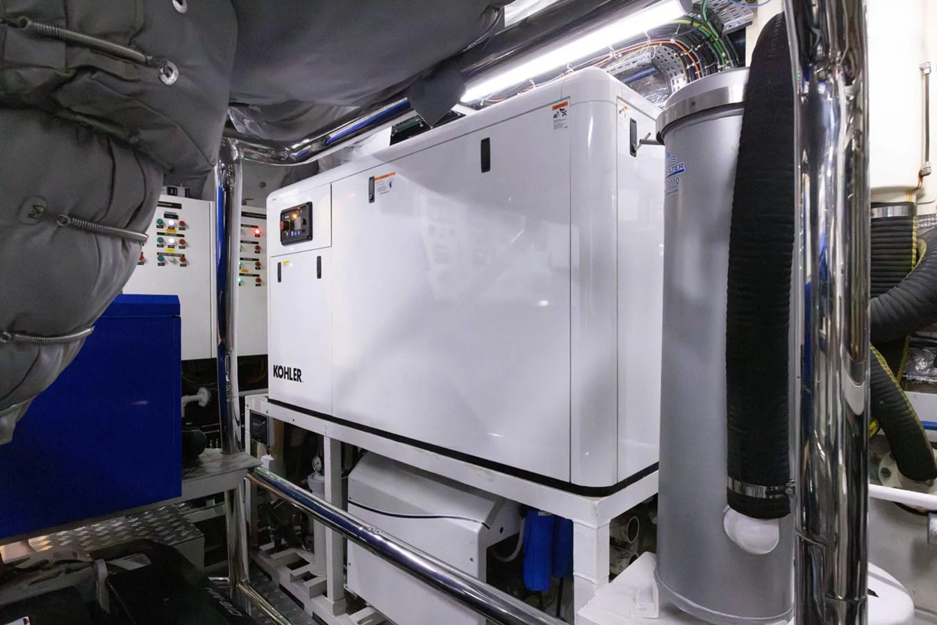 a machine with a large piece of equipment in it aboard KANDO Yacht for Sale