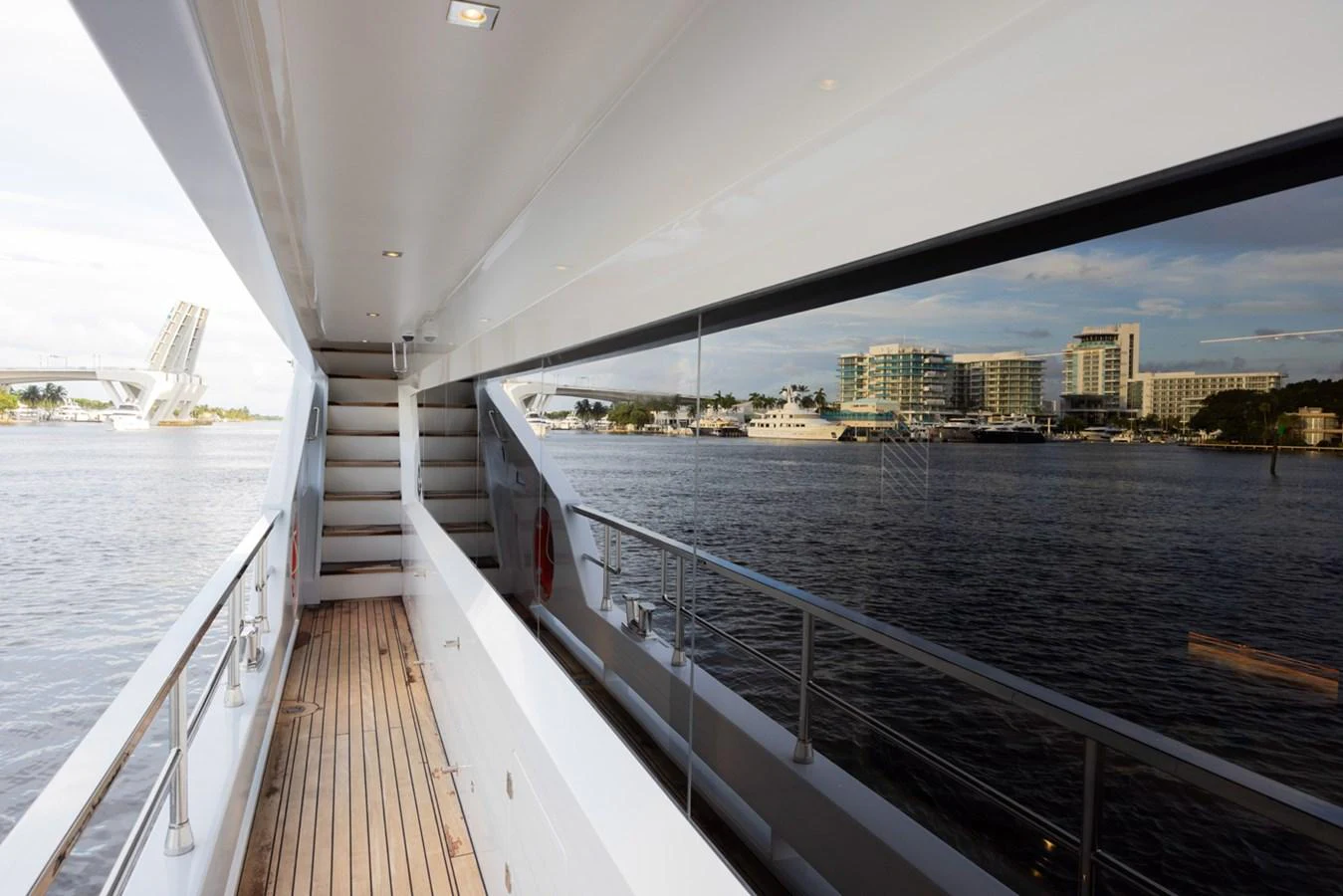 a large body of water with a bridge and buildings on the side aboard KANDO Yacht for Sale