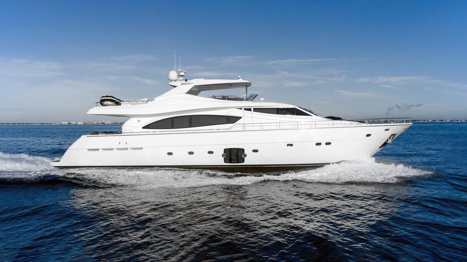 a white yacht on the water aboard NACL Yacht for Sale