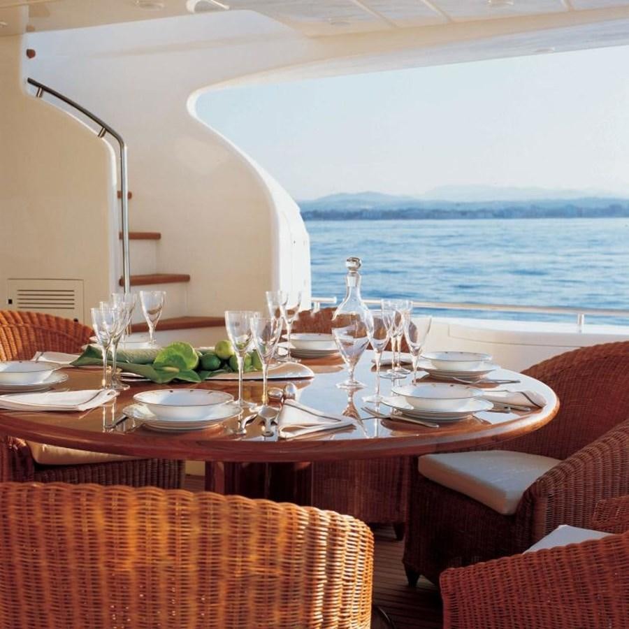 a table set for a dinner aboard NACL Yacht for Sale