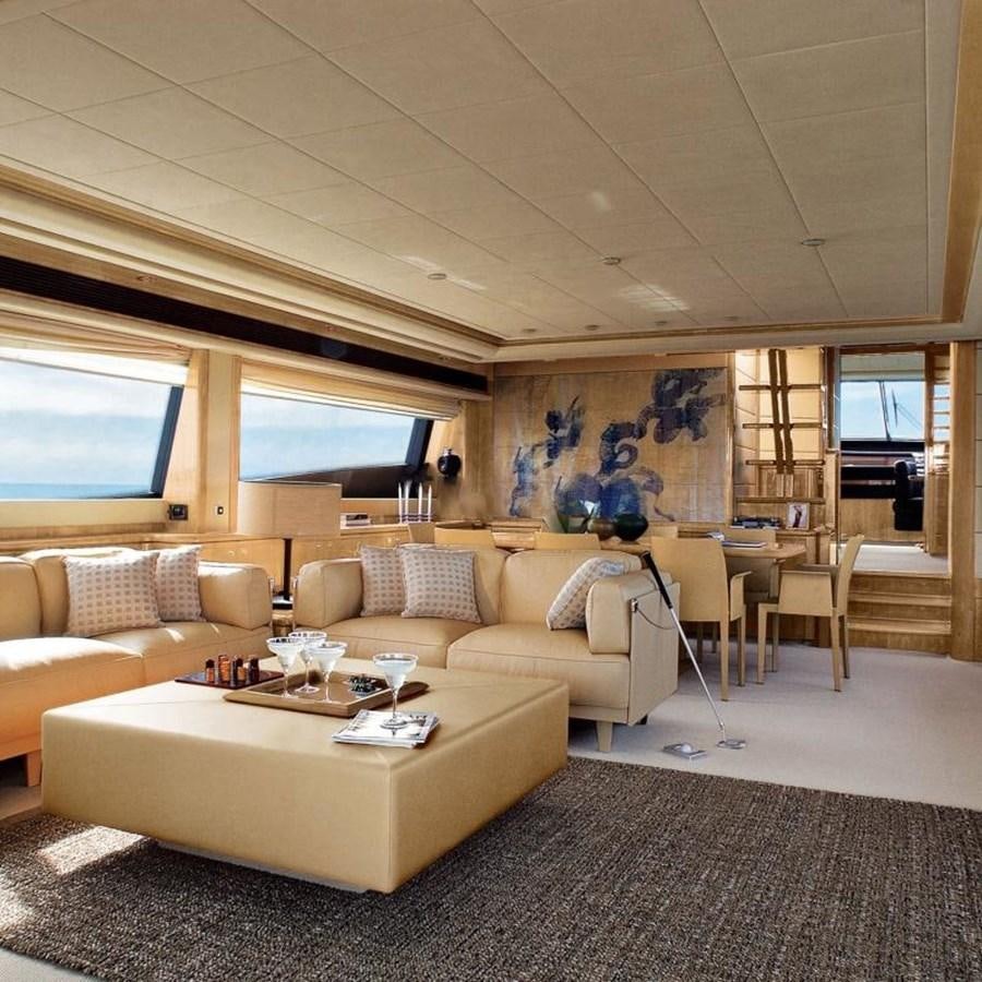a living room with a couch and a tv aboard NACL Yacht for Sale