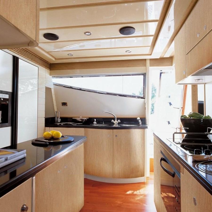 a kitchen with a stove and a sink aboard NACL Yacht for Sale