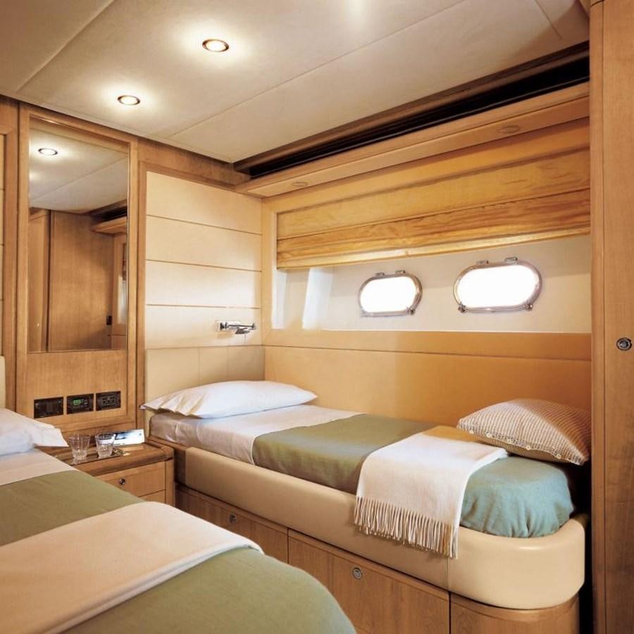 a room with two beds aboard NACL Yacht for Sale