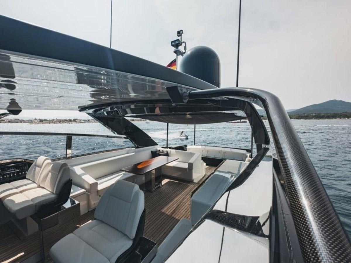 a boat with a person on the deck aboard NO Yacht for Sale