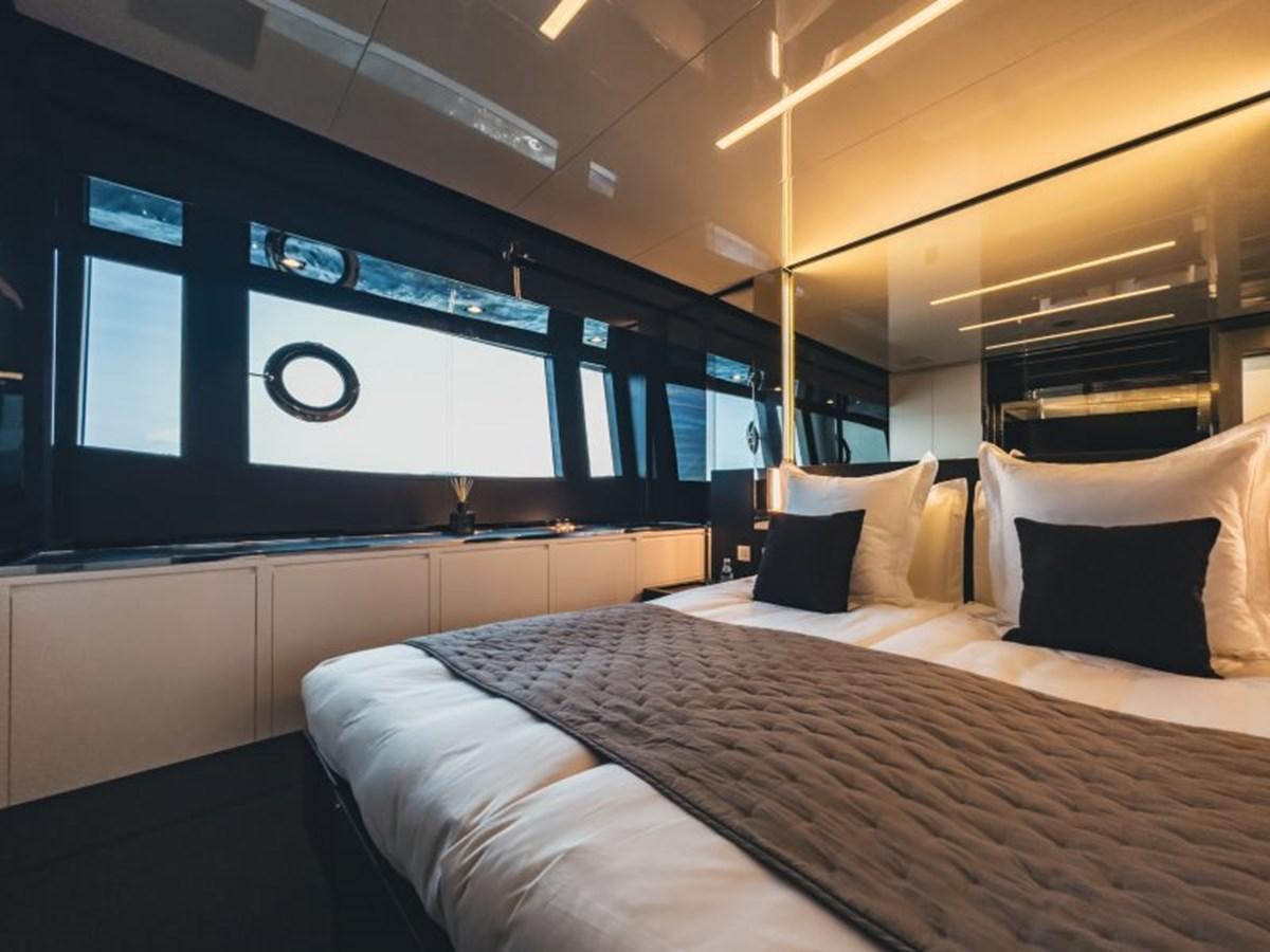 a bed with pillows aboard NO Yacht for Sale