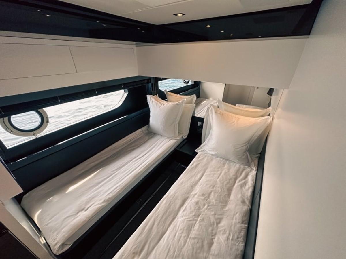 a room with a bed and a window aboard NO Yacht for Sale