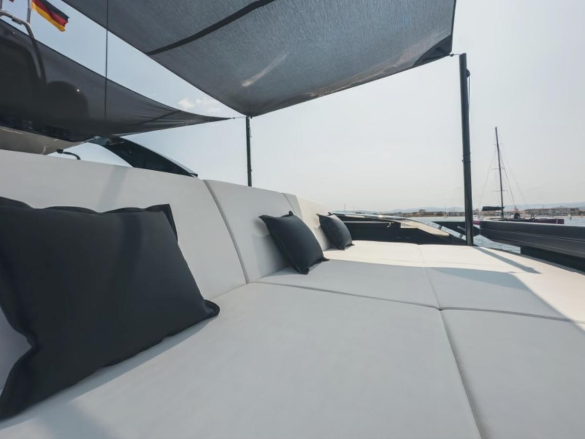 a white lounge chair on a deck aboard NO Yacht for Sale