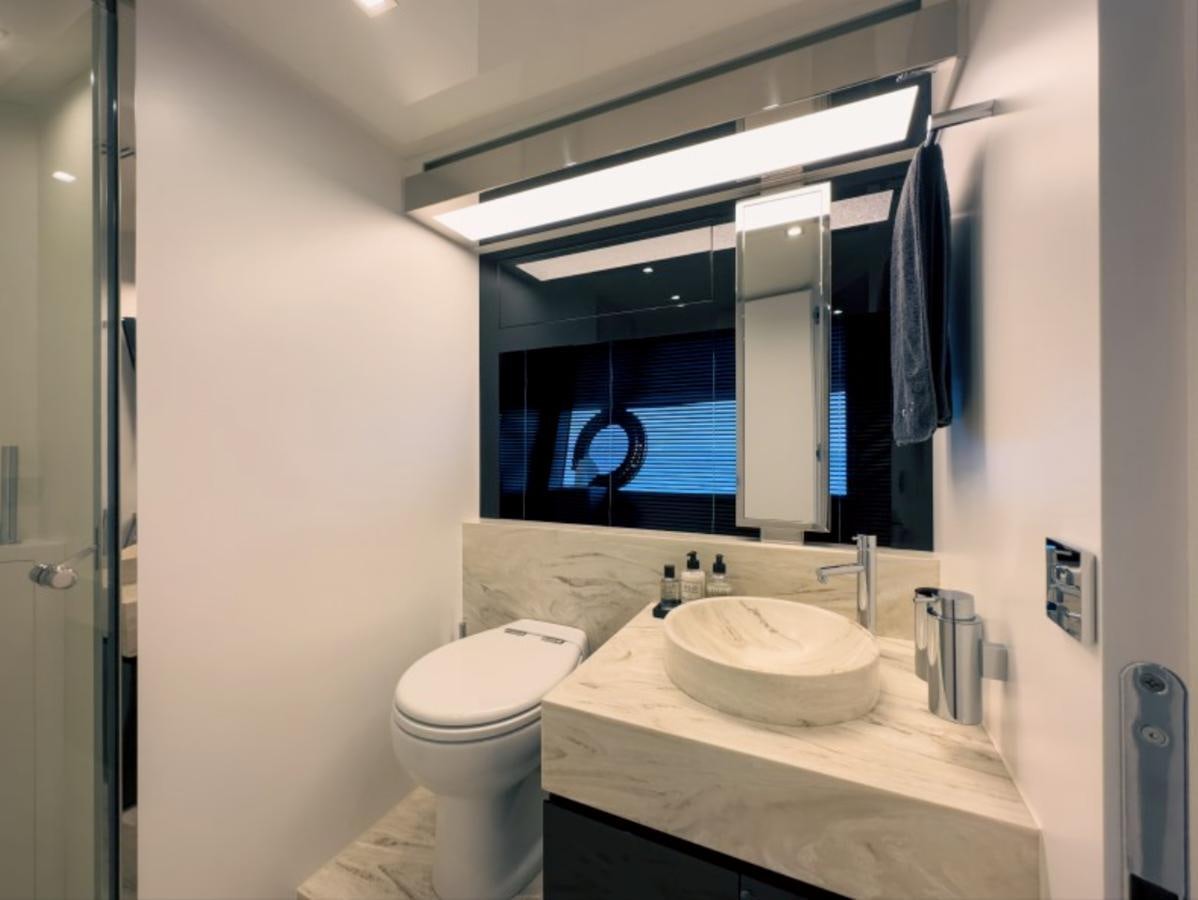 a bathroom with a large mirror aboard NO Yacht for Sale