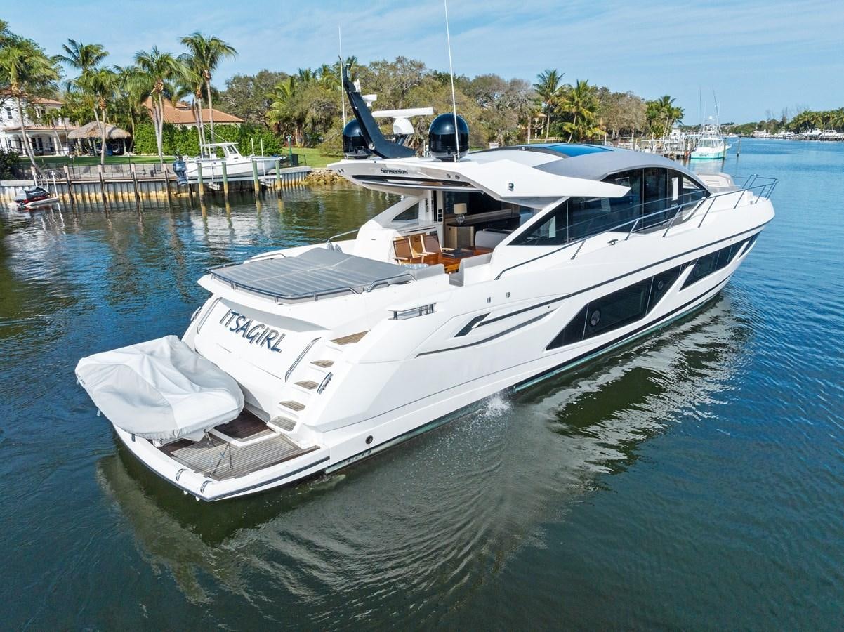 a white boat in a body of water aboard IT'S A GIRL Yacht for Sale