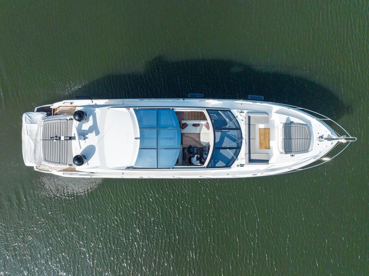 a white and blue boat on water aboard IT'S A GIRL Yacht for Sale