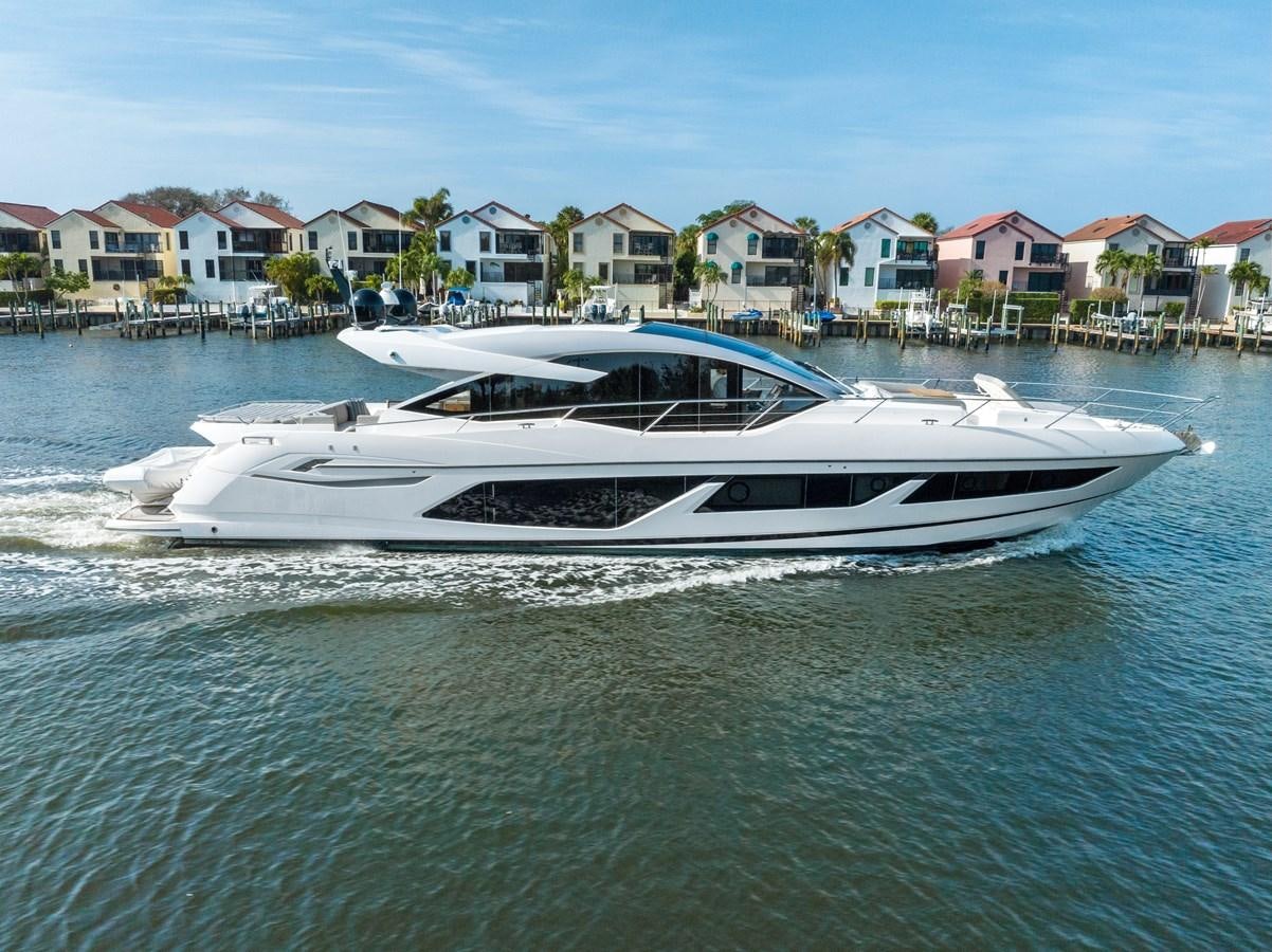 a white boat on the water aboard IT'S A GIRL Yacht for Sale