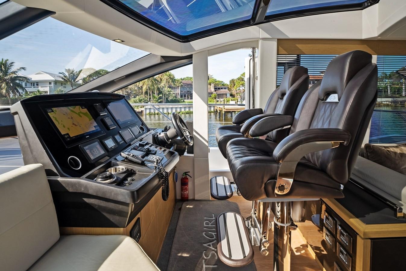 inside of a car with a large window and a view of the water aboard IT'S A GIRL Yacht for Sale