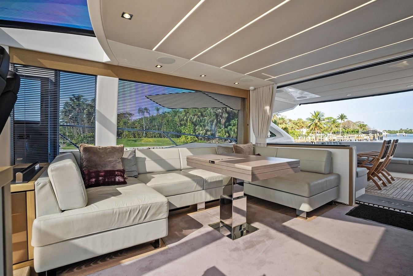 a living room with a large window aboard IT'S A GIRL Yacht for Sale