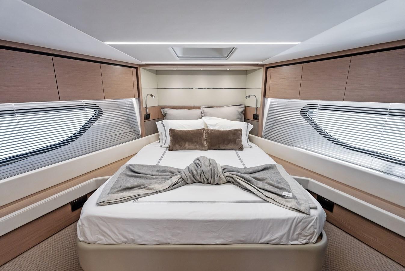 a room with beds and a window aboard IT'S A GIRL Yacht for Sale