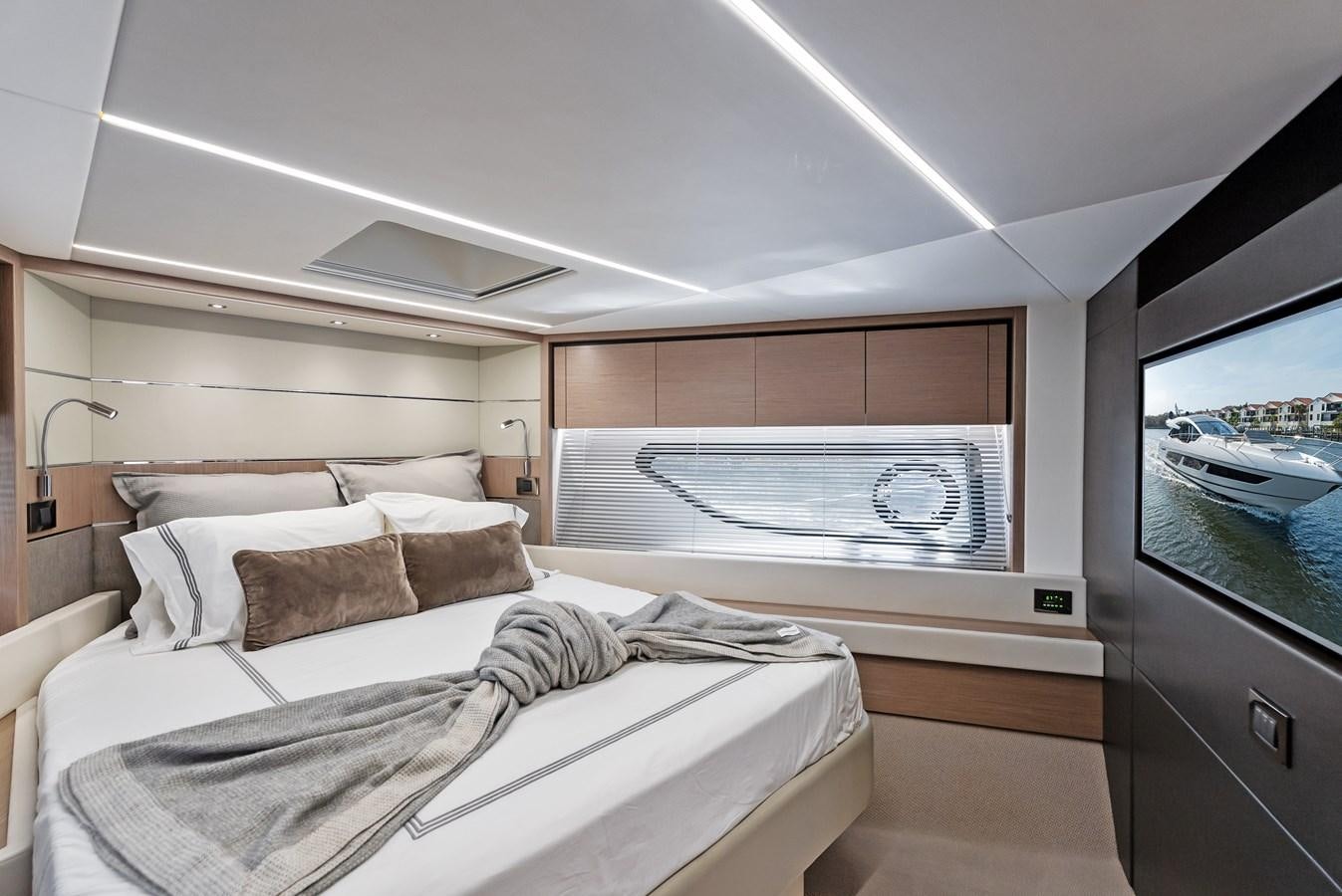 a room with a bed and a tv aboard IT'S A GIRL Yacht for Sale