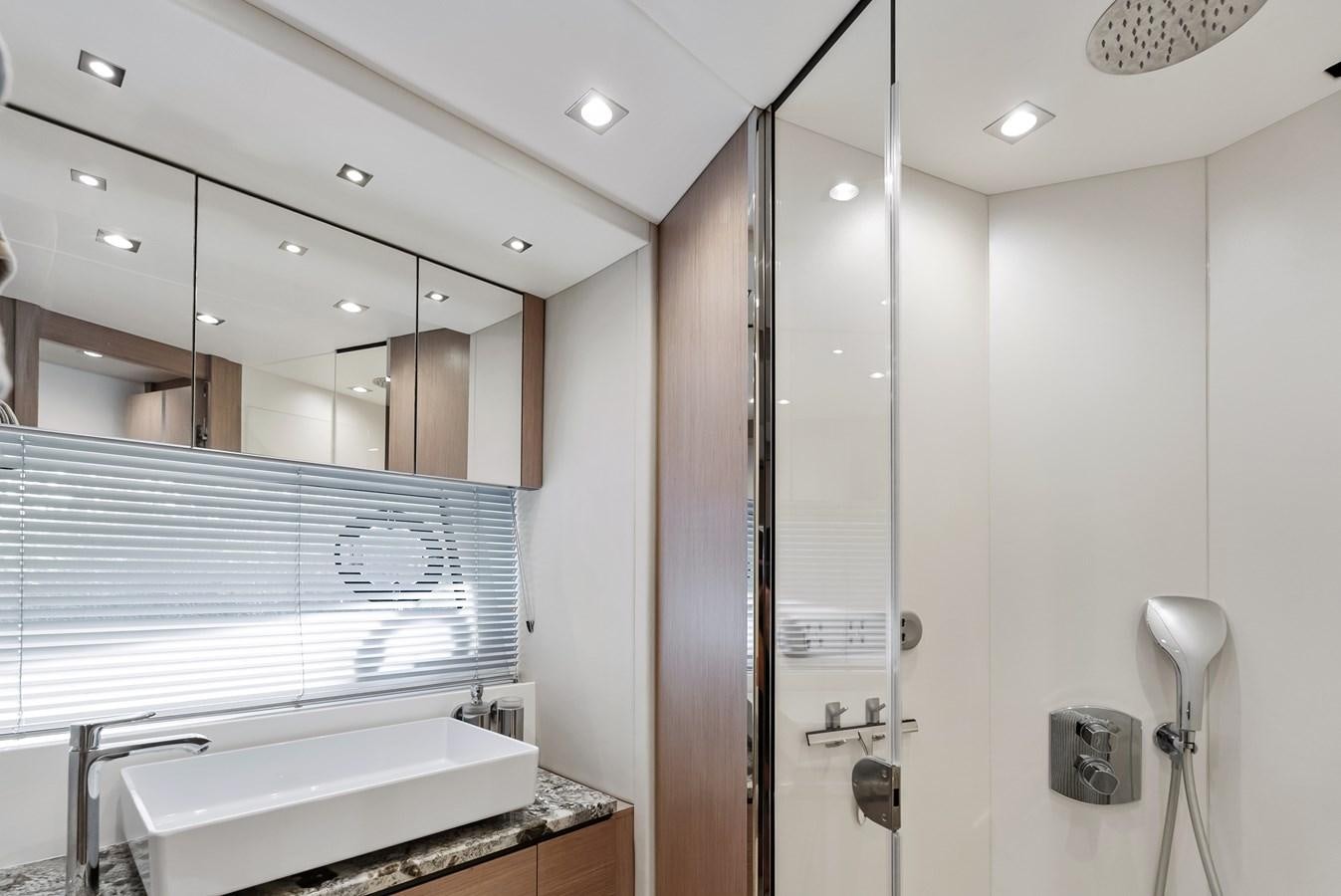 a bathroom with a shower unit and sink aboard IT'S A GIRL Yacht for Sale