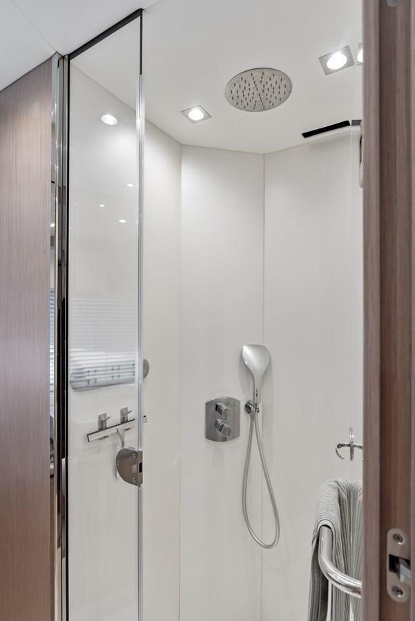 a shower with a telephone on the wall aboard IT'S A GIRL Yacht for Sale