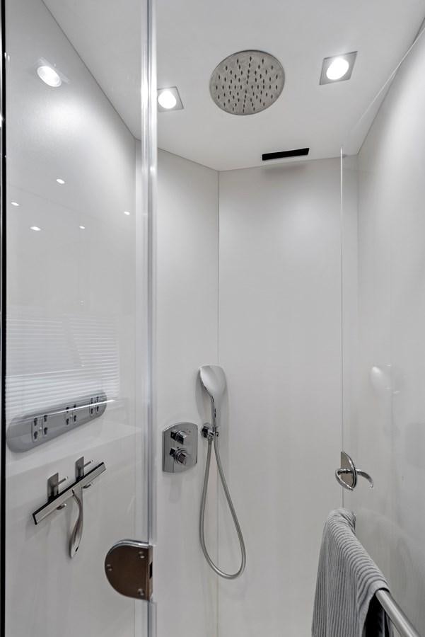 a shower with a sink and a mirror aboard IT'S A GIRL Yacht for Sale