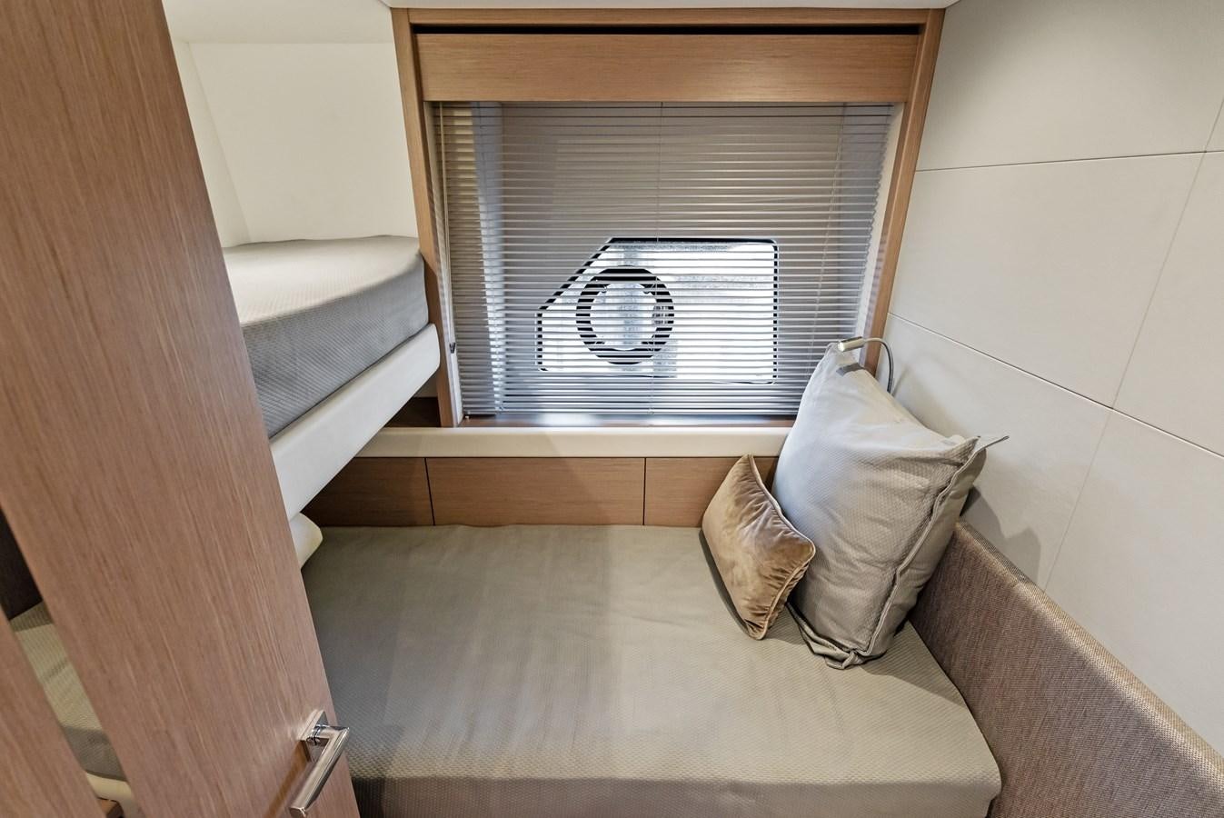 a room with a bed and a window aboard IT'S A GIRL Yacht for Sale