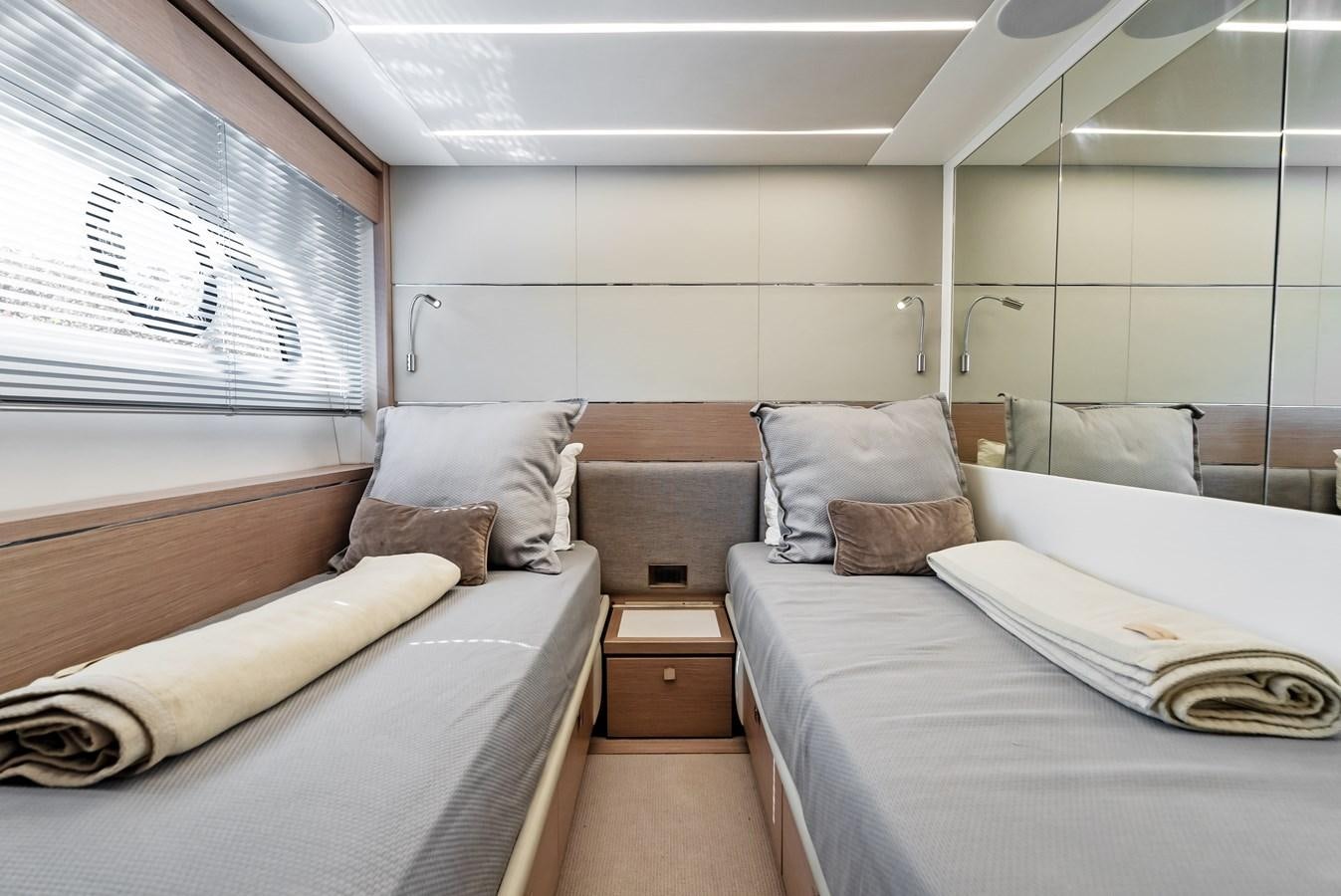 a room with a bed and a window aboard IT'S A GIRL Yacht for Sale