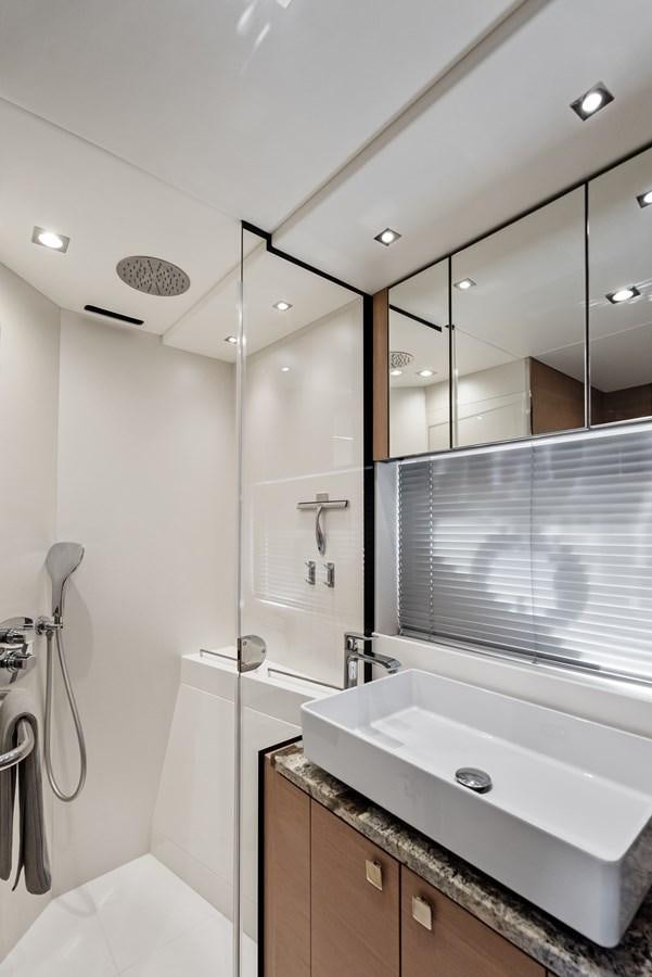 a bathroom with a shower and sink aboard IT'S A GIRL Yacht for Sale