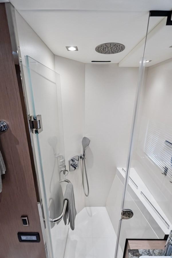a shower unit with a sink and mirror aboard IT'S A GIRL Yacht for Sale