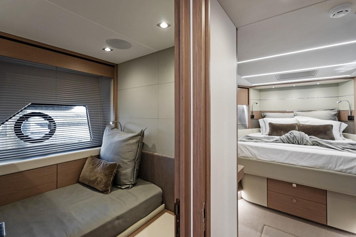 a room with a bed and a couch aboard IT'S A GIRL Yacht for Sale