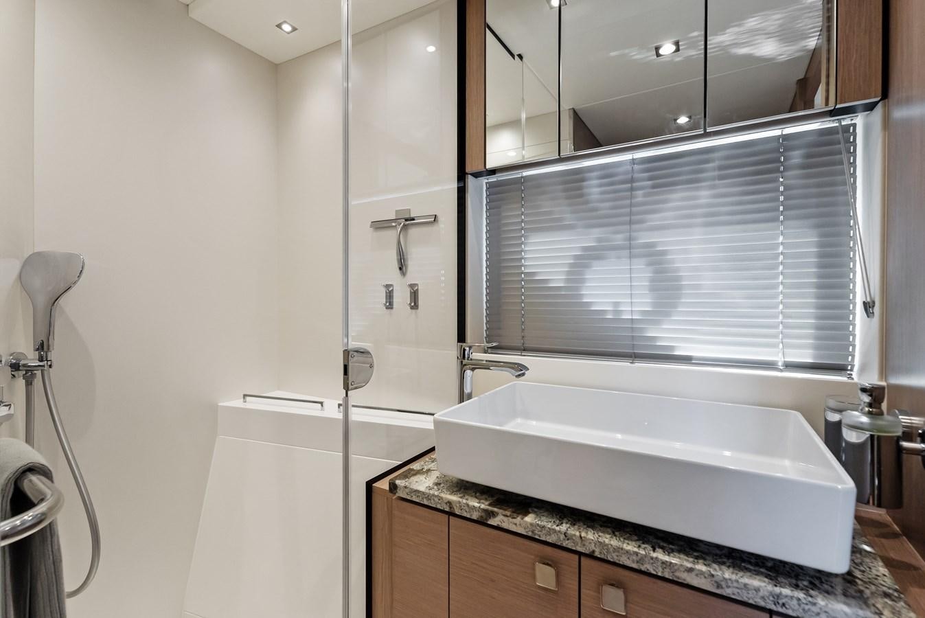 a bathroom with a tub and sink aboard IT'S A GIRL Yacht for Sale