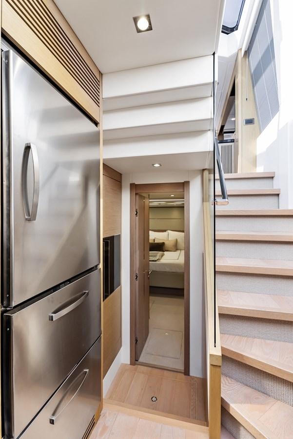 a kitchen with a stainless steel refrigerator aboard IT'S A GIRL Yacht for Sale