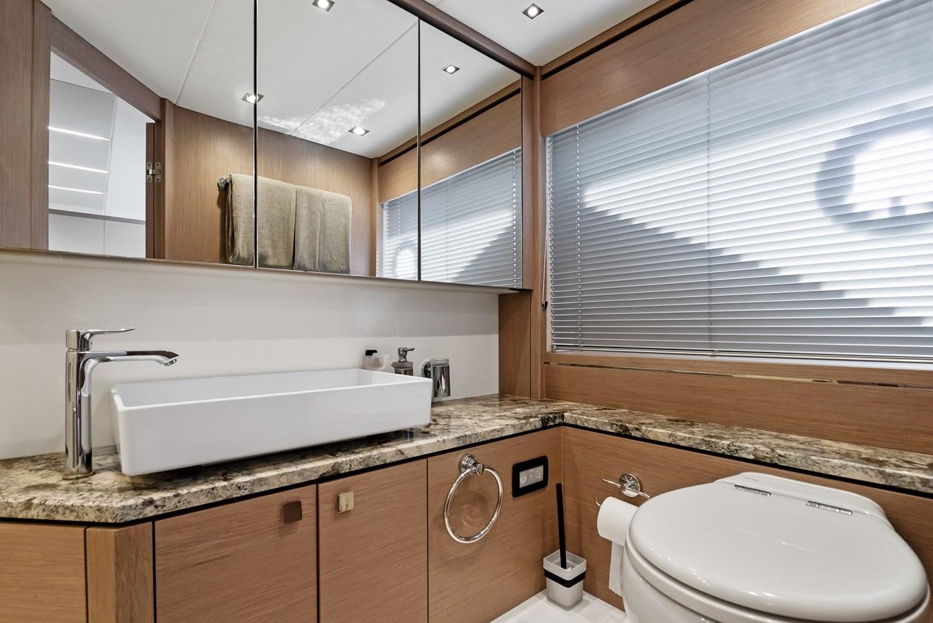 a bathroom with a sink and a toilet aboard IT'S A GIRL Yacht for Sale