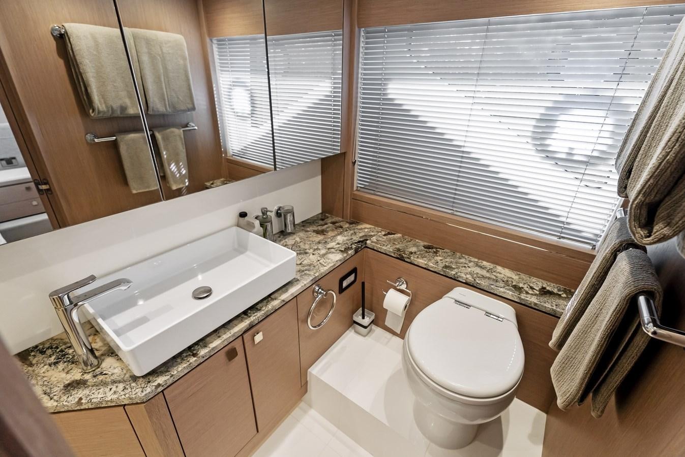 a bathroom with a sink toilet and a bathtub aboard IT'S A GIRL Yacht for Sale